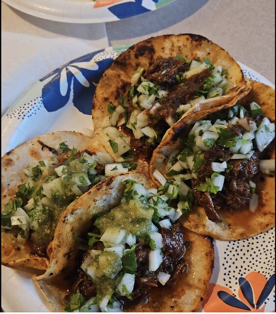 Birria-style tacos with cilantro and onion